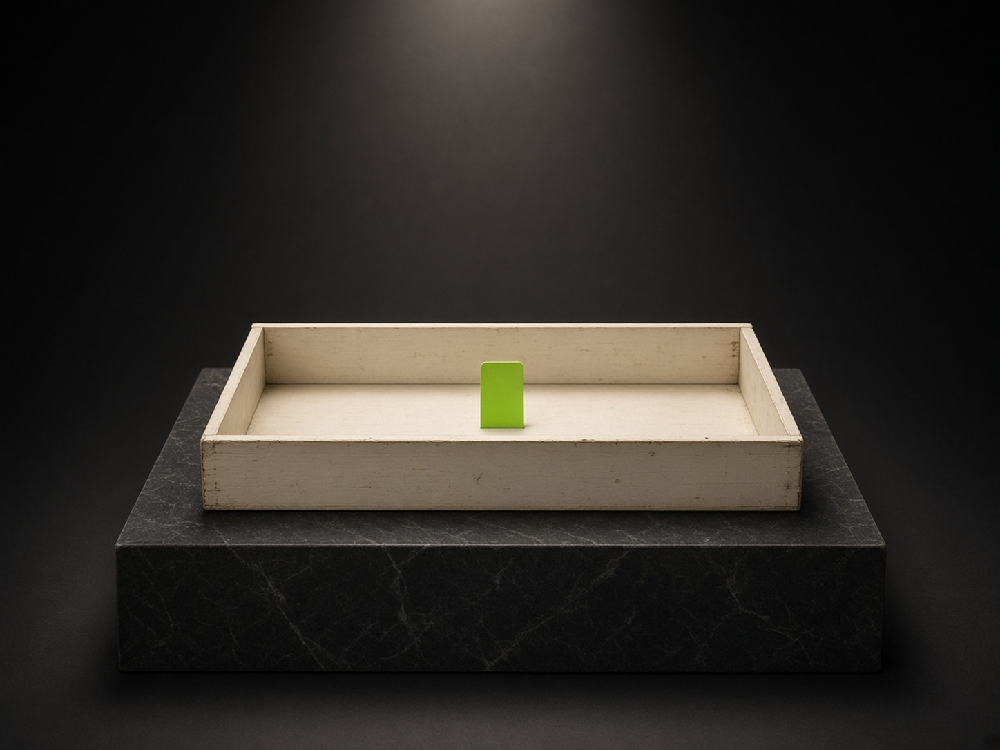 AI-generated illustration: an open, empty ivory card-catalogue drawer on a stone plinth in a dark studio, with one small blank lime-green index tab at the front. A metaphor for an emptied repository, not an image of the incident.